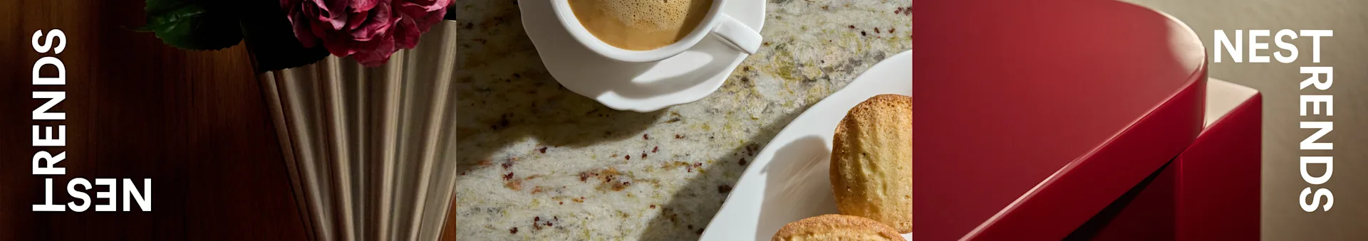 Chávena de café, madeleines, rosa em vaso canelado sobre bancada, junto a caixa vermelha com 'NEST TRENDS'.